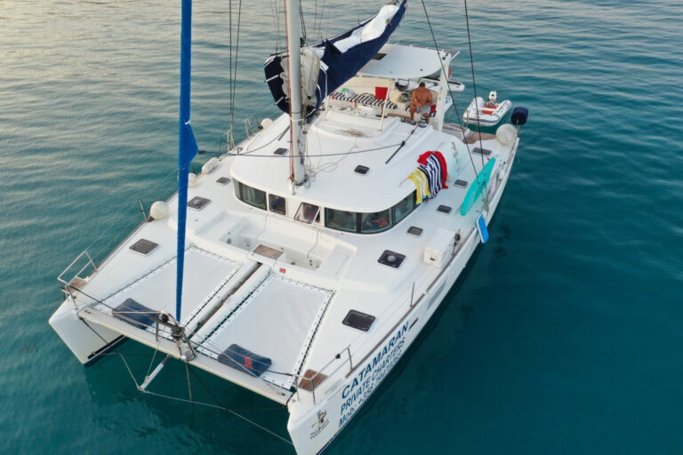 Aerial view of Pupa Mia catamaran anchored in Malta's clear water