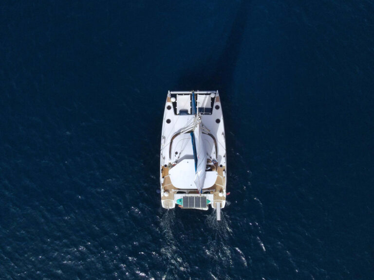 Aerial view looking straight down onto Chiquita catamaran underway