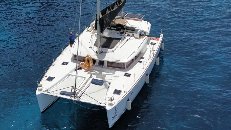 Aerial view of Siesta Mia catamaran anchored in Malta's clear water