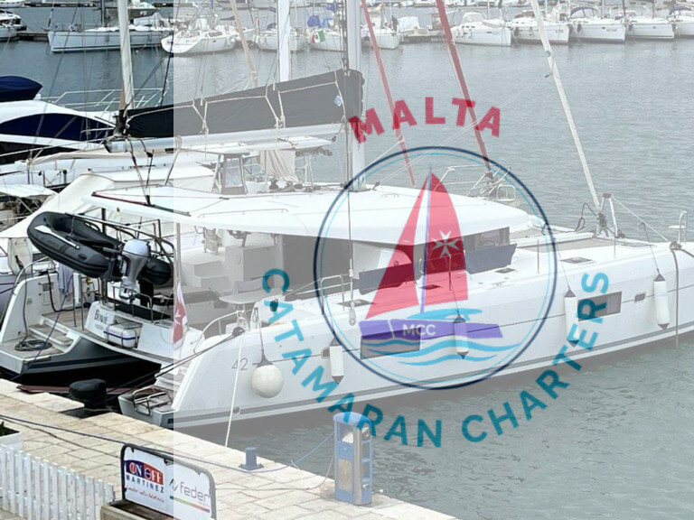 Bowie Lagoon 42 catamaran moored at a marina, name plate visible