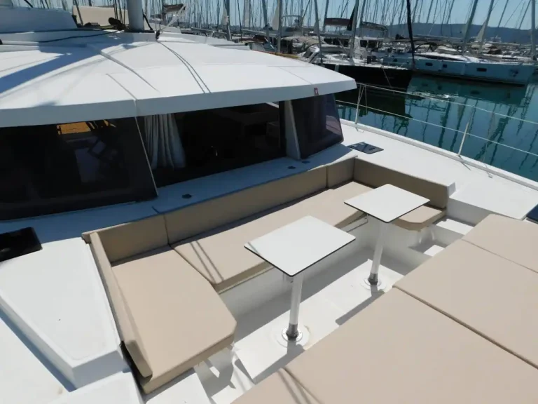 Bali 4.0 Catspace deck seating and side tables at a marina