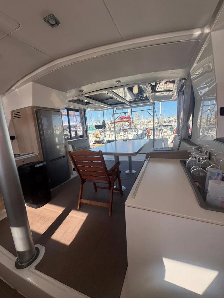 View from the Angelina Mia saloon through the open cockpit to the marina in Malta